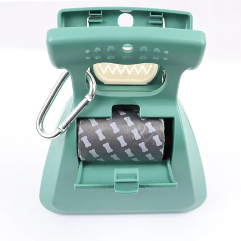 Midello pet waste scooper close-up showing spring-loaded jaws and durable grip